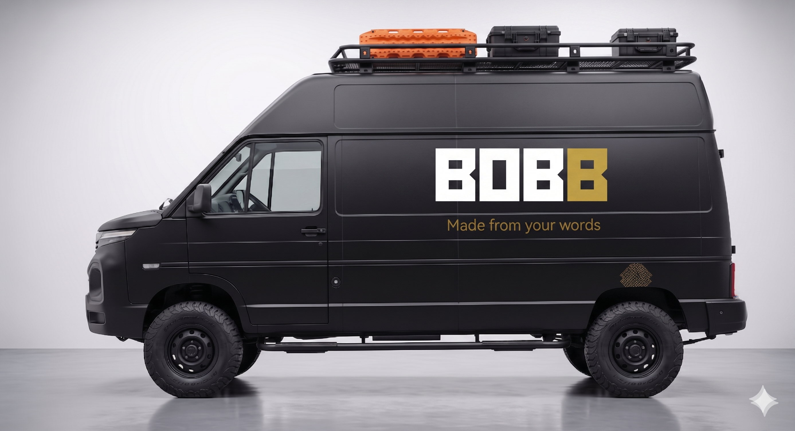 The BOBB van in matte black with the white and gold BOBB wordmark and 'Made from your words' livery