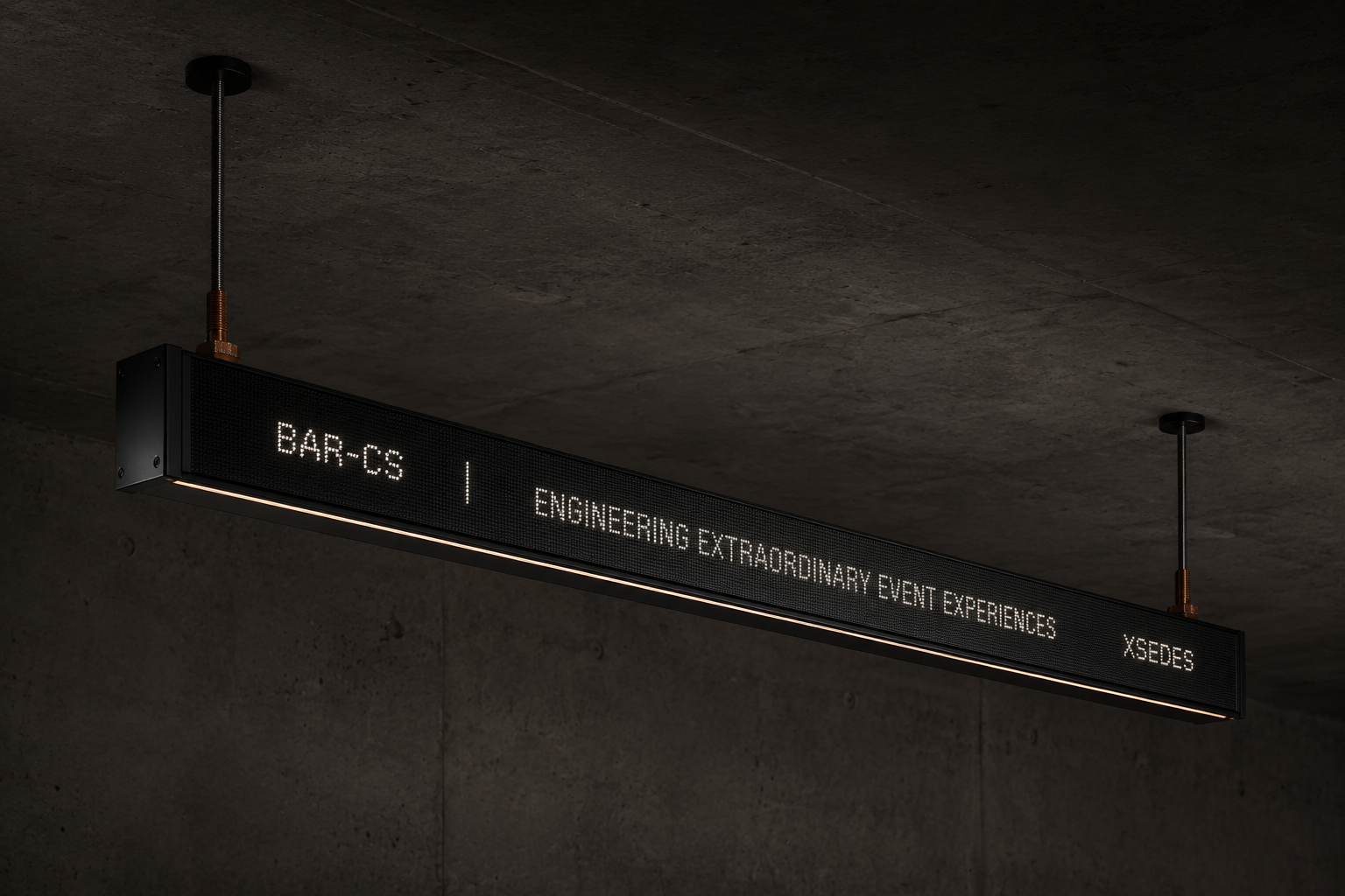 OBLIK Bar linear fixture suspended from concrete on rods with bronze collars and warm underside light
